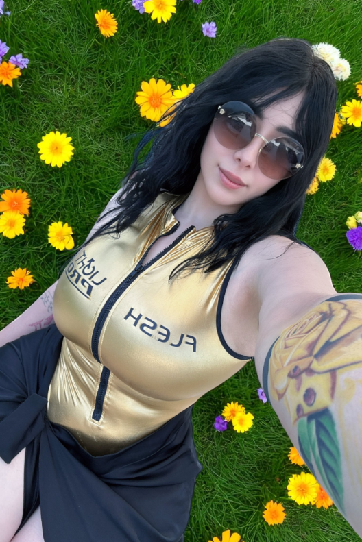 Momokun OnlyFans she is laying on the grass